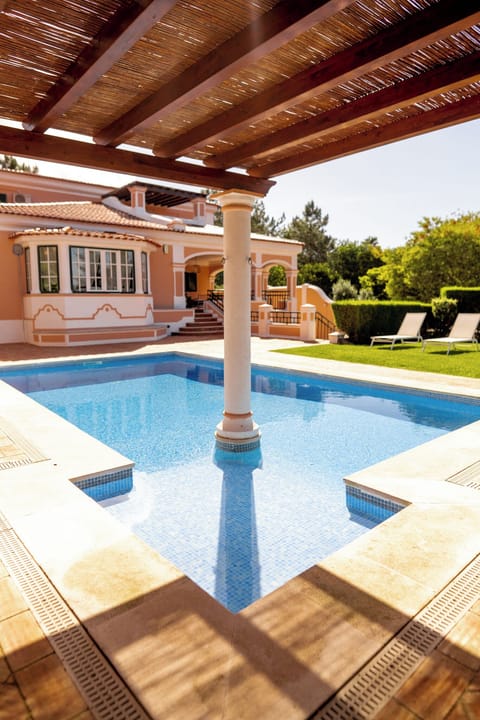 The Swimming Pool - Long chairs, hammocks, green grass and plenty of space.