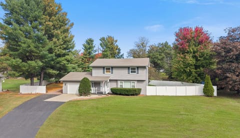 Spacious lawn, privacy fence, and charming curb appeal
