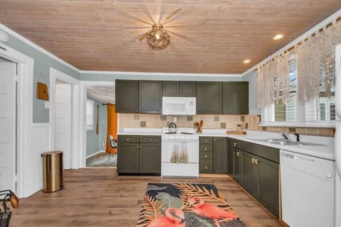 Kitchen. To the left is one bedroom and the bathroom.