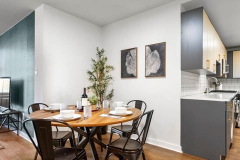 You’ll love gathering around the table in this stylish dining area, perfect for enjoying meals or working remotely during your stay.