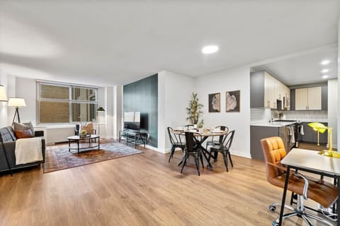 The expansive layout connects the living, dining, and kitchen spaces, providing an open and airy environment where you can feel at home, whether you're preparing a meal or relaxing on the sofa.