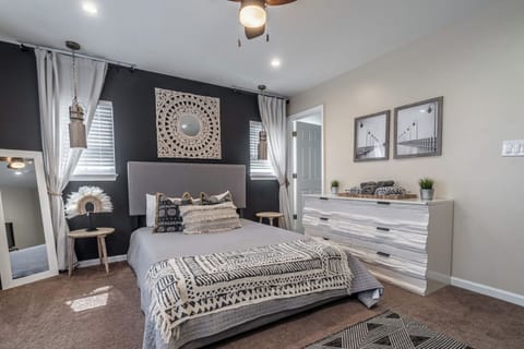Front bedroom with queen bed, full size fold out futon, full length mirror, and its own bathroom