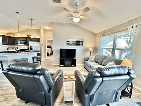 Beautiful Natural Light in the Living Room with Flatscreen TV and Fireplace