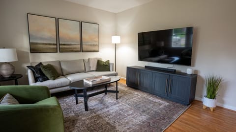 Living Room which features 65" TV on fully articulating mount.