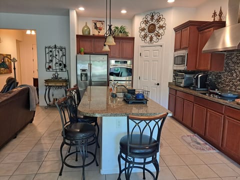 Chef's Kitchen fully stocked including air fryer, Keurig, double oven, gas stove