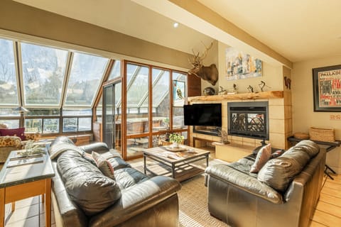 Main Level Living Room with Gas Fireplace and 50" Smart TV