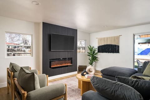 Kick back and relax in an oversized, comfy couch with a 65` smart TV