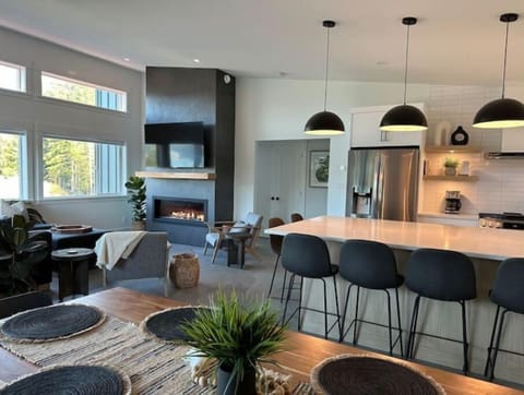 Upstairs open concept living space with high ceilings and stunning ocean views.