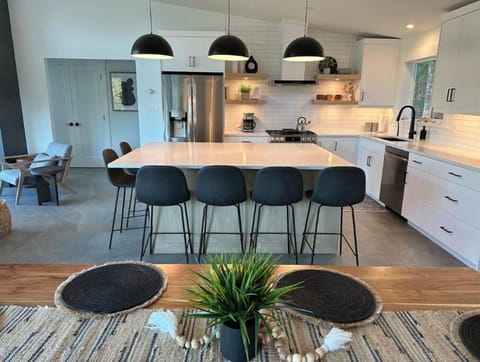 Comfortable seating for 14 around the 8 foot island and live-edge dining table.