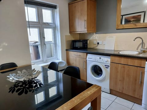 Cosy bright kitchen fully equipped with utilities.