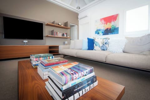 Living room opening entirely onto the pool terrace, air conditioning, ceiling fans, HD-TV, Dish Network, Apple TV, Sonos Bluetooth speaker, telephone, WIFI. 