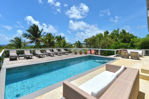 Nice heated pool facing the view, deck chairs. Gas barbecue.