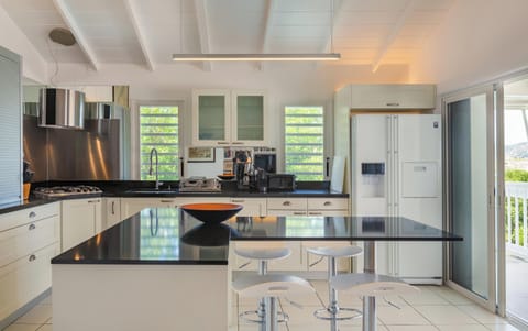 Located on the lower level. Equipped for eight people. Air conditioning, fan, breakfast bar with three stools, small cupboard, mosquito nets, fridge, freezer, oven, dishwasher, microwave, espresso and Nespresso coffee machine, blender, electric kettle, to