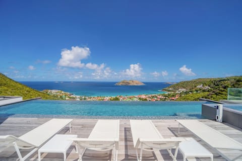 Beautiful heated pool 14 x 4m , with whirlpool side. Lovely heated paddling pool with floating loungers. Large and spacious sunny deck with sofas and several lounge chairs.