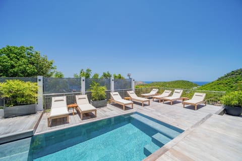 Nice pool surrounded by a spacious sun terrace with deckchairs. Nice outdoor lounge area. 