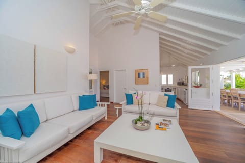 Inside living room with HD-TV, DVD player, Dish Network satellite, iPod dock, ceiling fan. 