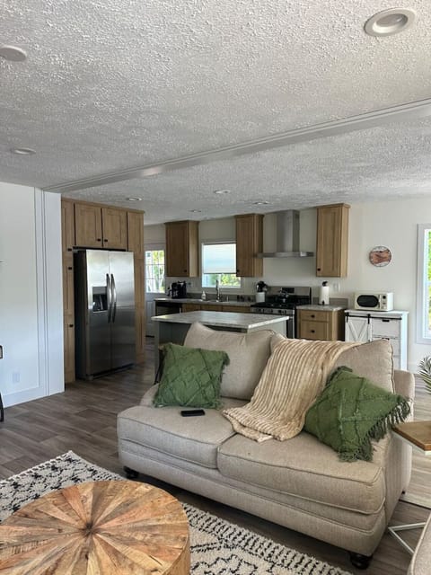 Living Room: Bright and airy space with modern decor and inviting seating for leisurely gatherings!