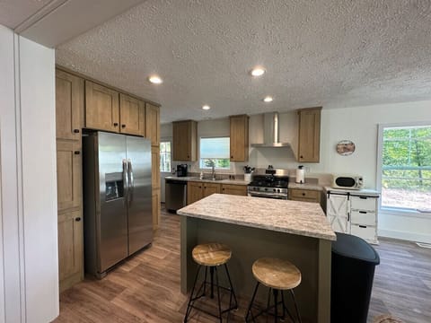 Gourmet Kitchen: Create culinary masterpieces in this sunlit, modern kitchen with ample space!