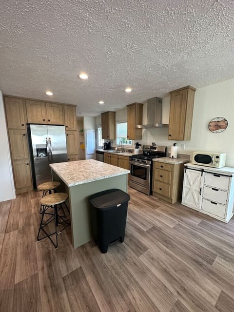 Gourmet Kitchen: Modern appliances and a stylish island make cooking a delight!