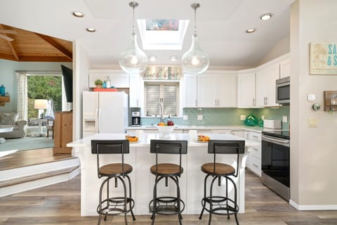 Spacious kitchen with ample counterspace and breakfast bar with three additional seats at the counter.