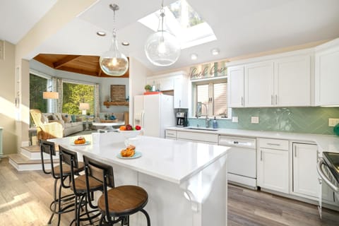 Spacious kitchen with ample counterspace and breakfast bar with three additional seats at the counter.