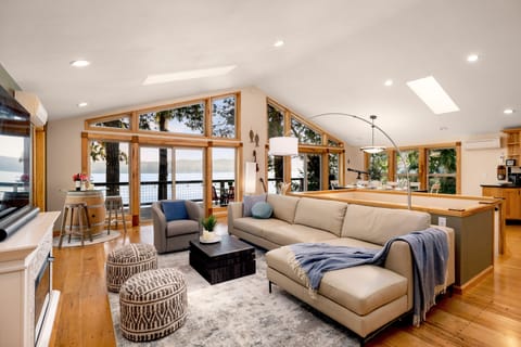 Spacious and cozy living room with an electric fireplace and TV