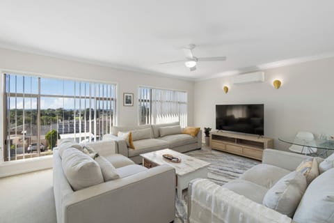 The cosy living area is replete with plenty of seating for the entire group, loads of natural light and a ceiling fan to keep you cool in the warmer months.