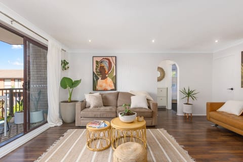 The light-filled living area extends to a private balcony, creating a seamless flow from the indoors out and allowing natural breezes to flow through.
