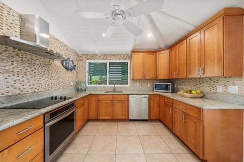 Spacious and fully equipped kitchen with stainless steel appliances and ample storage