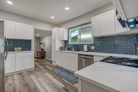 Our Fully Equipped Kitchen Features Beautiful Lighting and Abundant Space