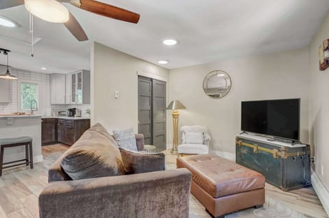 Kick back and relax in the inviting living area, complete with a Smart TV for your entertainment.