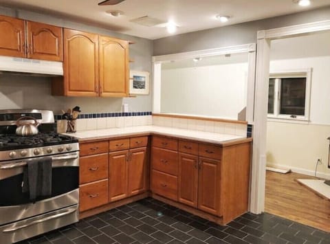 Large kitchen with a lot of counter space and all the tools you could need.