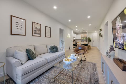 Open-concept floor plan seamlessly flowing the living room, dining area and fully equipped kitchen into one large space to keep your group together.