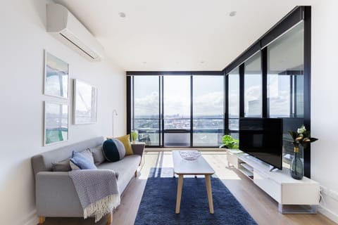 Relax in the living area, where you can stream your favorite shows and take in stunning city views.