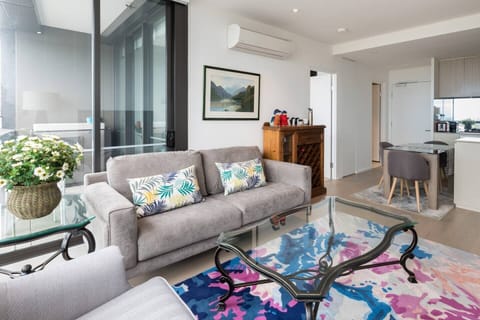 The lounge room has floor-to-ceiling windows that let invigorating light in, plenty of seating and a  50” flat-screen TV