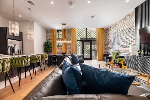 Living Room opens up to pool. Features queen-size sleeper sofa.