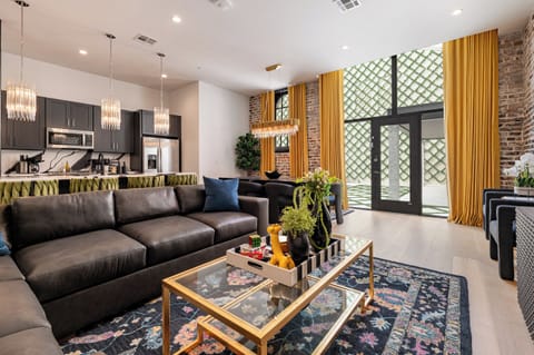Living Room opens up to pool. Features queen-size sleeper sofa.