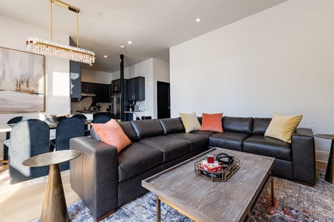 Living Room opens up to pool. Features queen-size sleeper sofa.