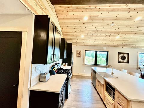 Your kitchen is fully stocked and featured quartz countertops.