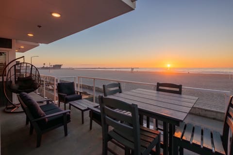 A spacious balcony with ample seating, offering stunning ocean views.