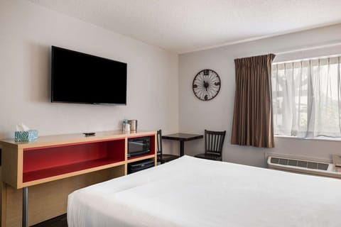 Relax after a long day with TV, fridge, and microwave nearby
