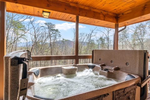 Soak and relax while enjoying the smokies on the balcony!