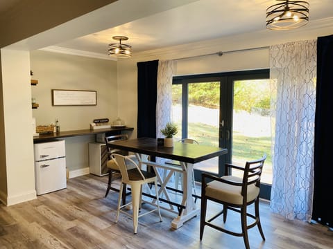 Dining and kitchenette with mini fridge, microwave, toaster oven & ice maker.