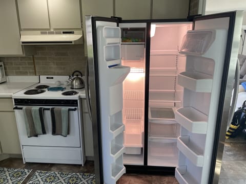 Large fridge and electric 4 burner stove top