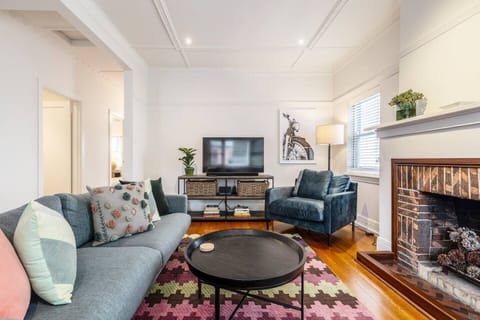 The living area offers ample space to relax, with a lounge and arm chairs fronting the TV for easy viewing. There is a dedicated study for those working remotely.