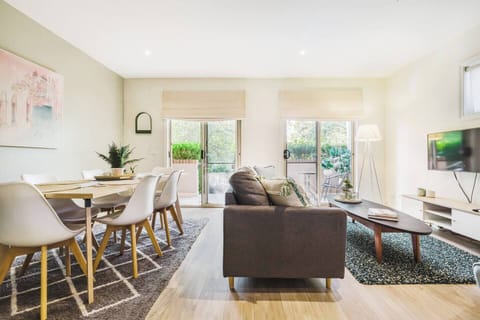 The stylish and cosy living area offers a 40" flat screen TV with Netflix and access to the lush patio.