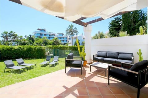 Private terrace with outdoor seating area and private garden with sun loungers