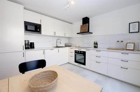 Another view of the modern kitchen, fully fitted with all the appliances