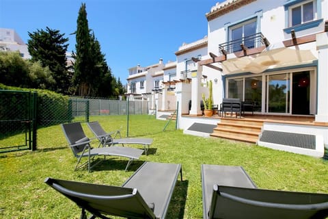 Sun loungers for four guests on the private garden