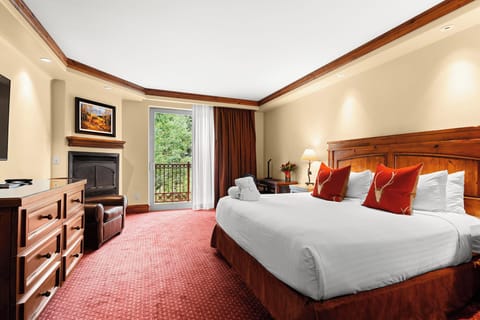 Unwind in a plush king bed with balcony breezes.